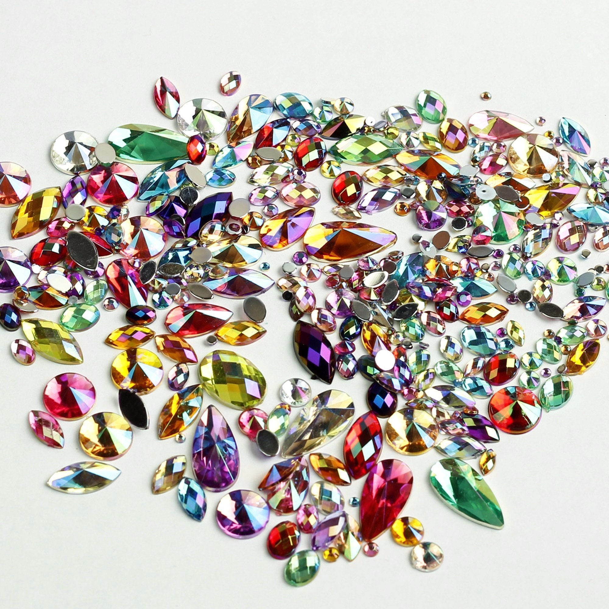 Sparkling iridescent gems in  rainbow mix of colours. Ideal for Glamoween sugar skull creations.
